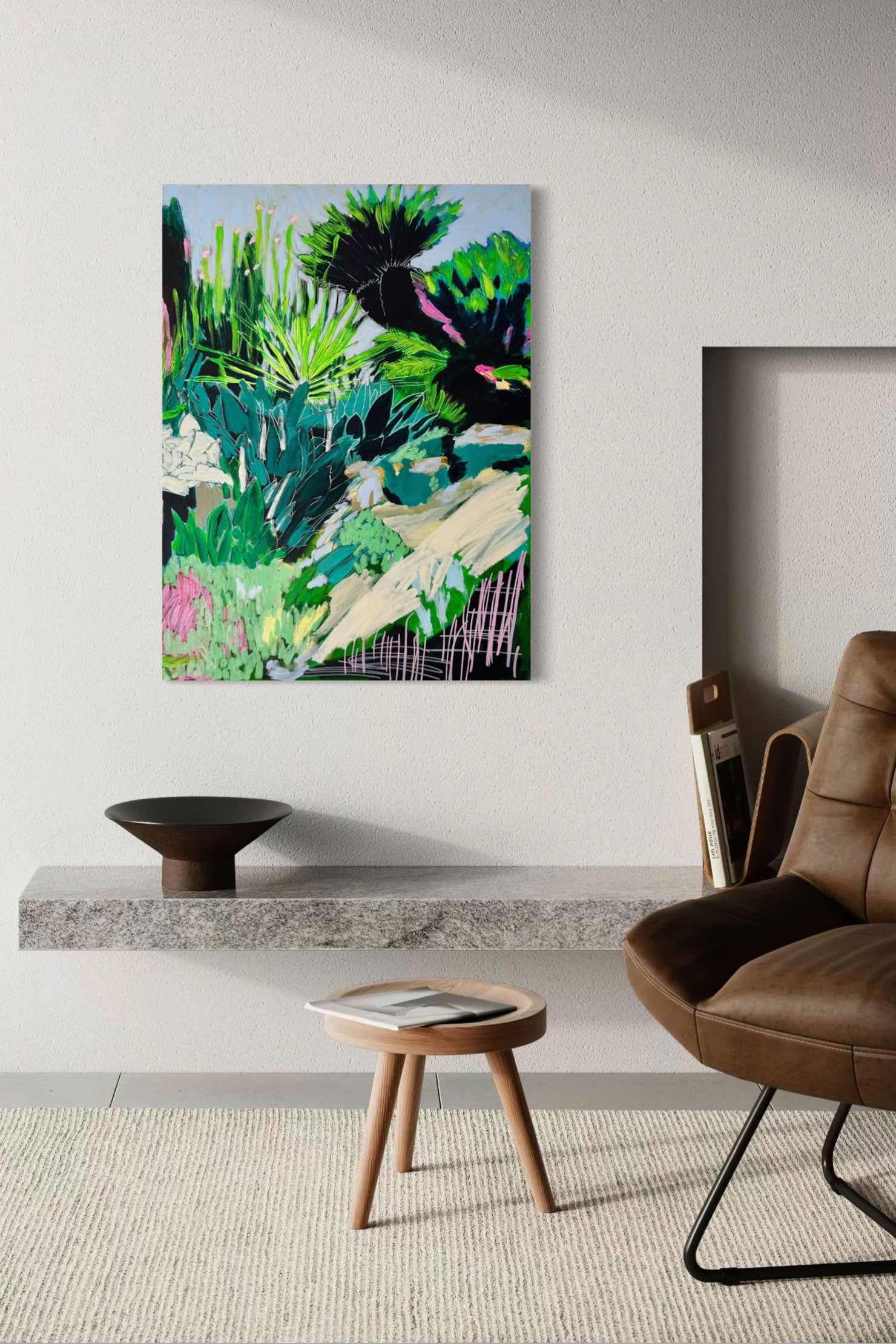 Modern interior with a painting of a tropical landscape, brown chair, and wooden stool.
