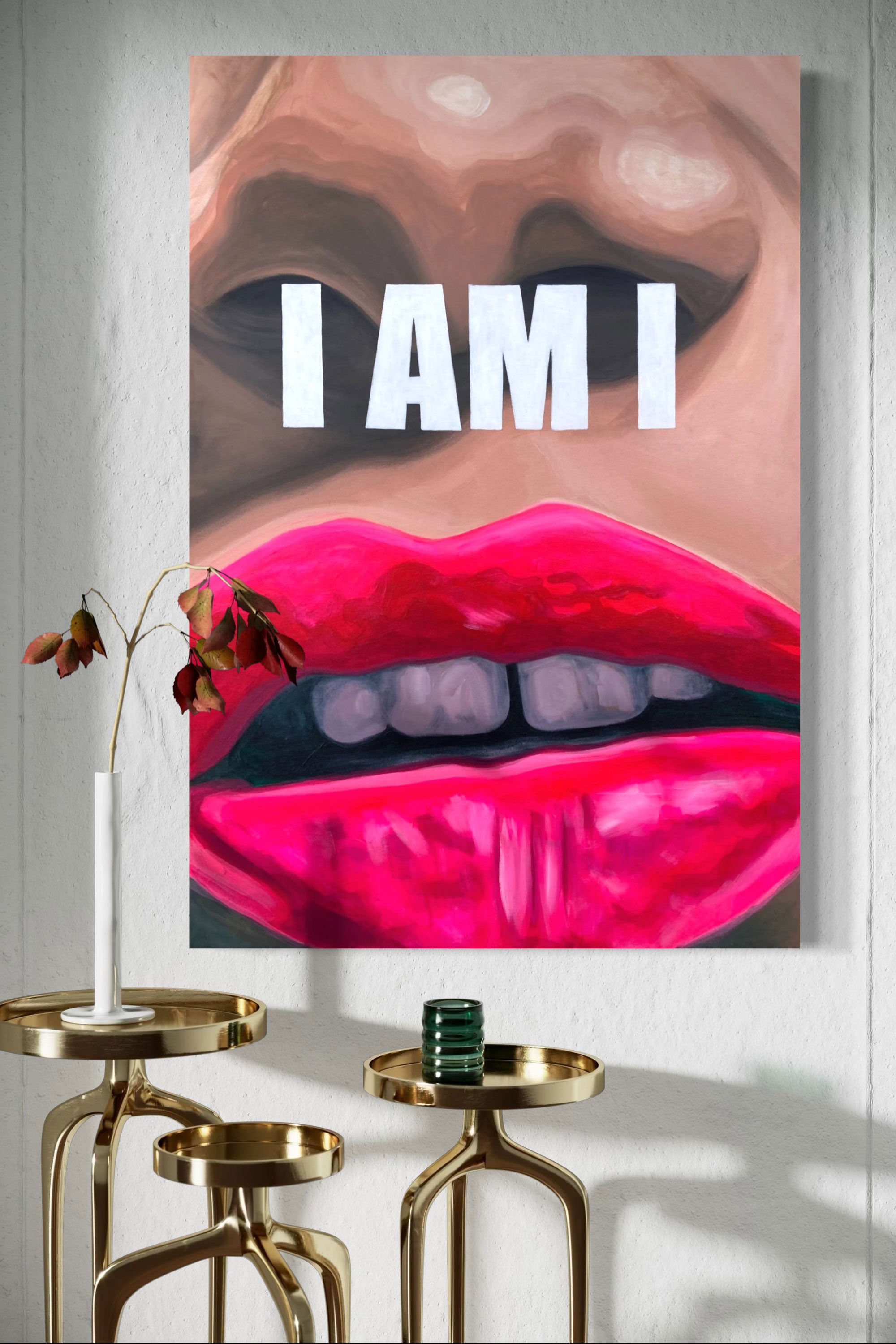 Original painting, close-up of lips with 'I AM I' text on a wall above gold side tables.