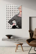 Modern living room with an original painting on the wall of a woman in a polka dot dress.