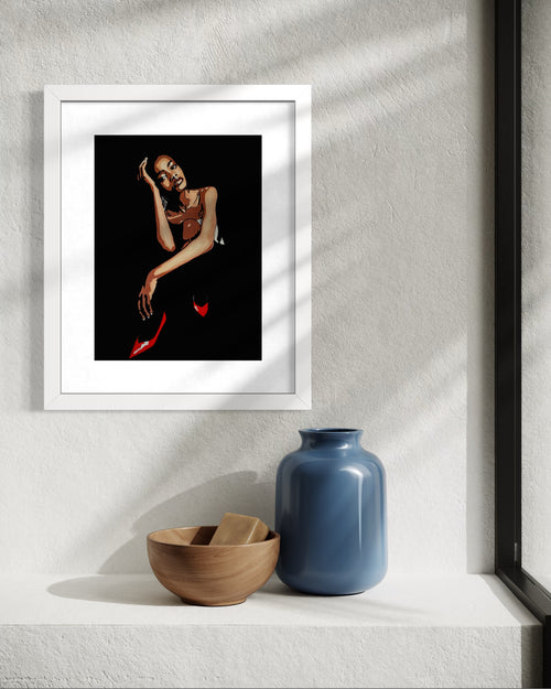 Framed artwork of a woman on a wall with decorative items below.  Limited edition print by Annie Pritchard