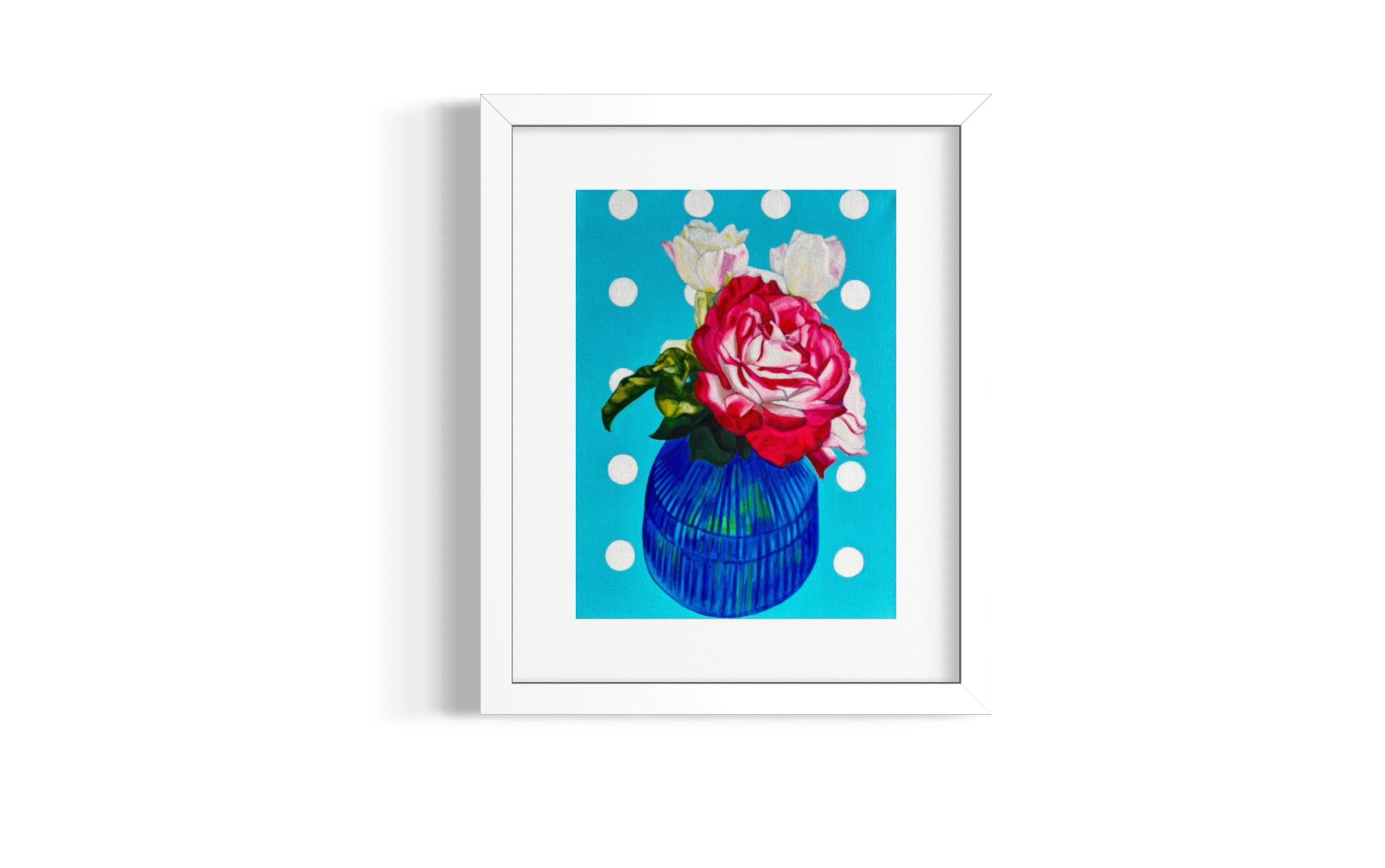 Framed limited edition print with a pink rose on a blue polka dot background