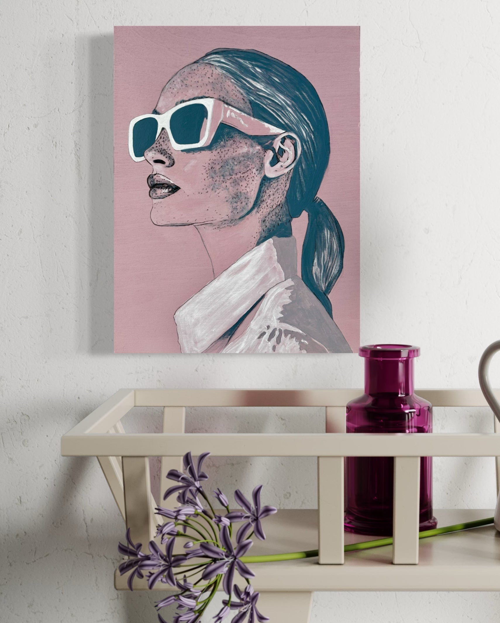 Acrylic painting on board of a stylised portrait with sunglasses, 'Frankie', on a wall above a shelf.
