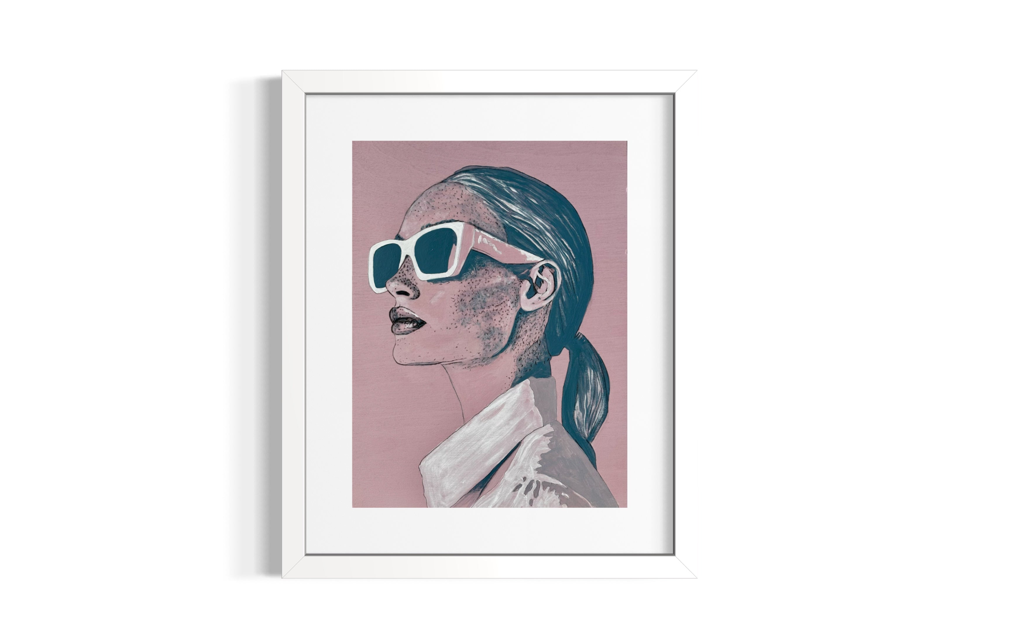 Framed artwork of a woman, 'Frankie', wearing sunglasses on a pink background