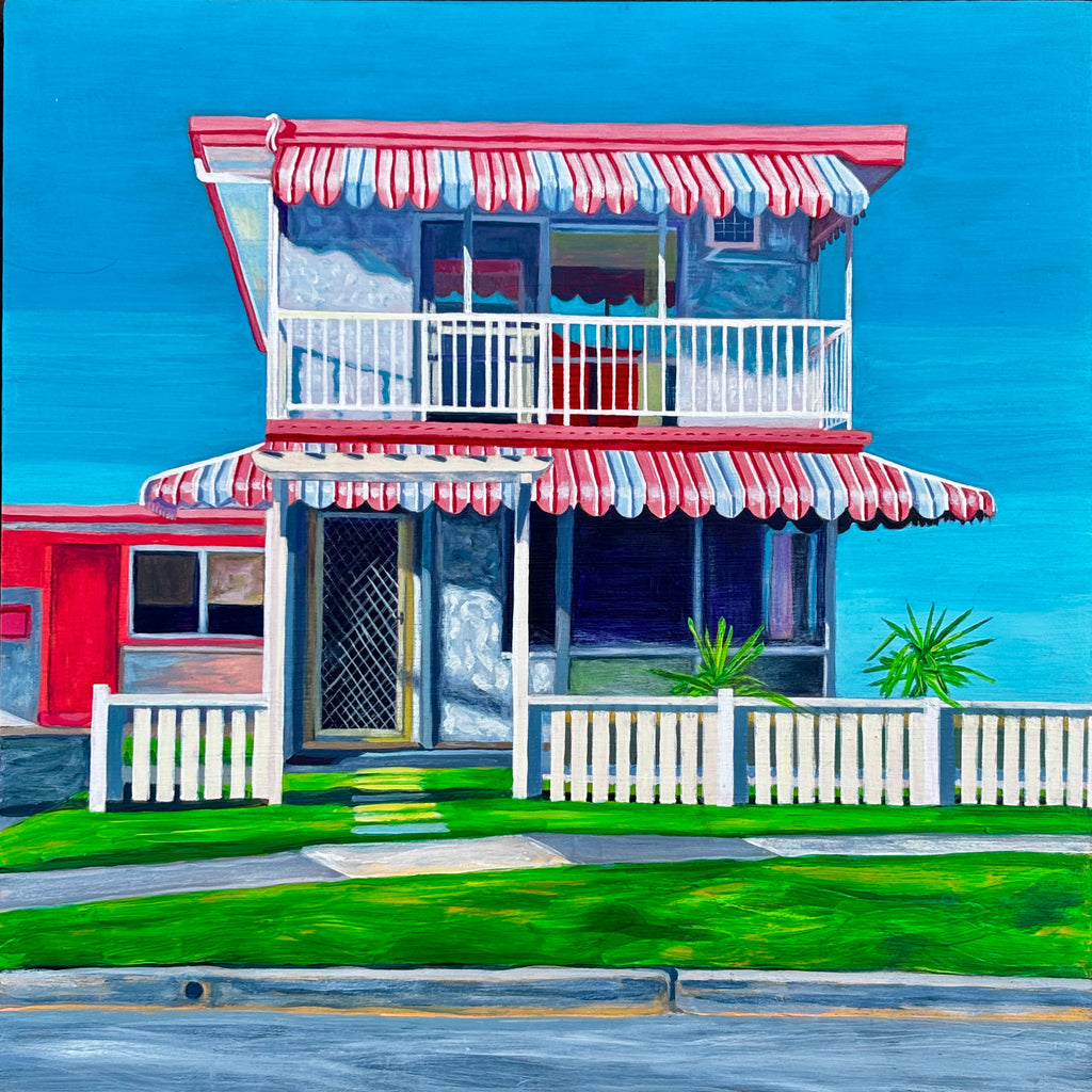 The Classic by Annie Pritchard, a painting of a two-storey house with striped awnings, a white fence and blue sky.