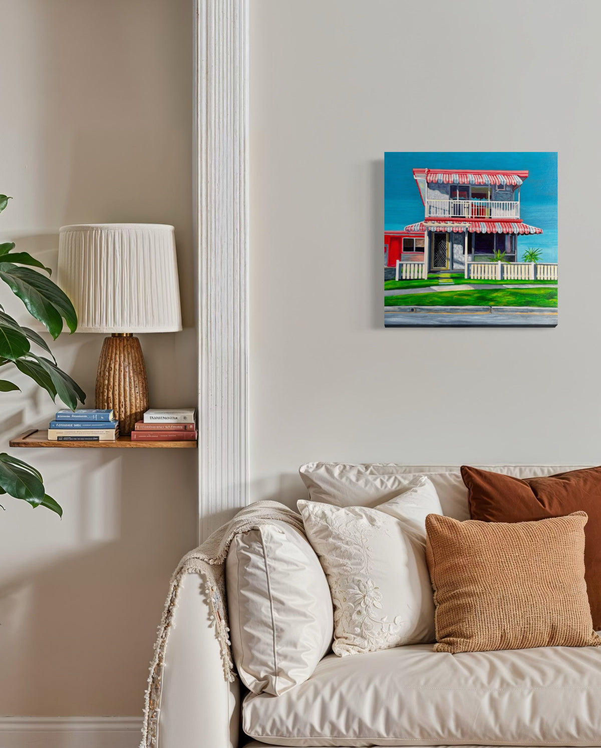 The Classic by Annie Pritchard displayed above a cream sofa with neutral cushions.
